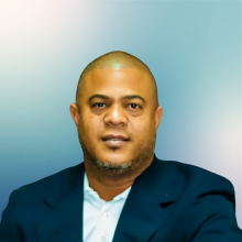 Professional portrait of a man in a suit, representing Punta Cana Trip, a luxury travel service provider in the Dominican Republic.